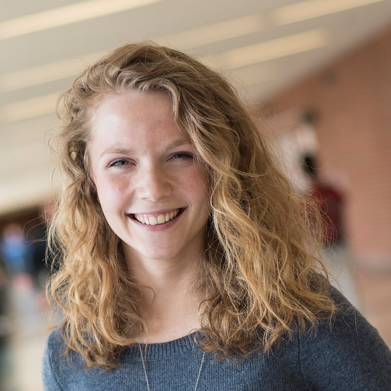 Smiling student in hallway.