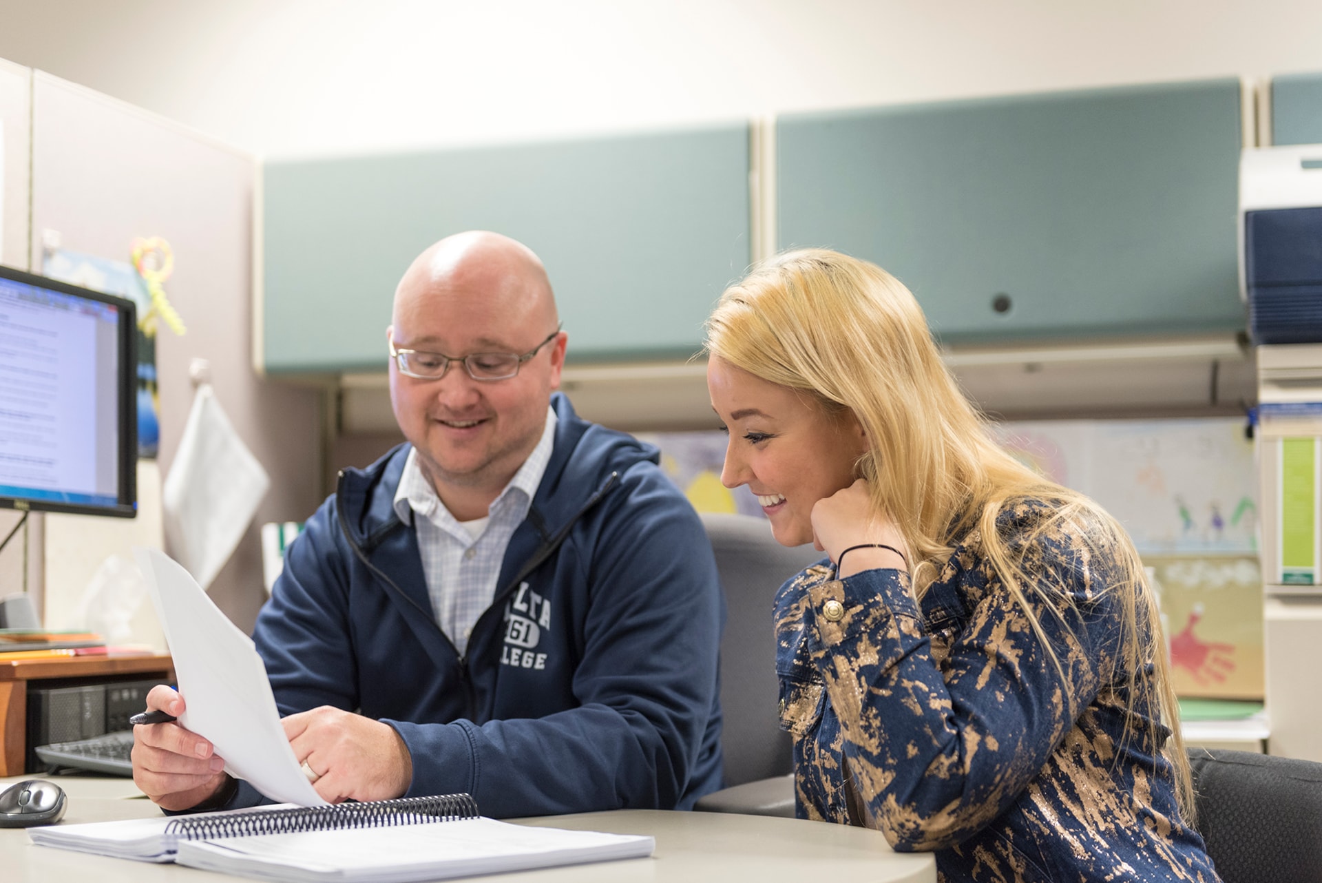 Advisor working with a student