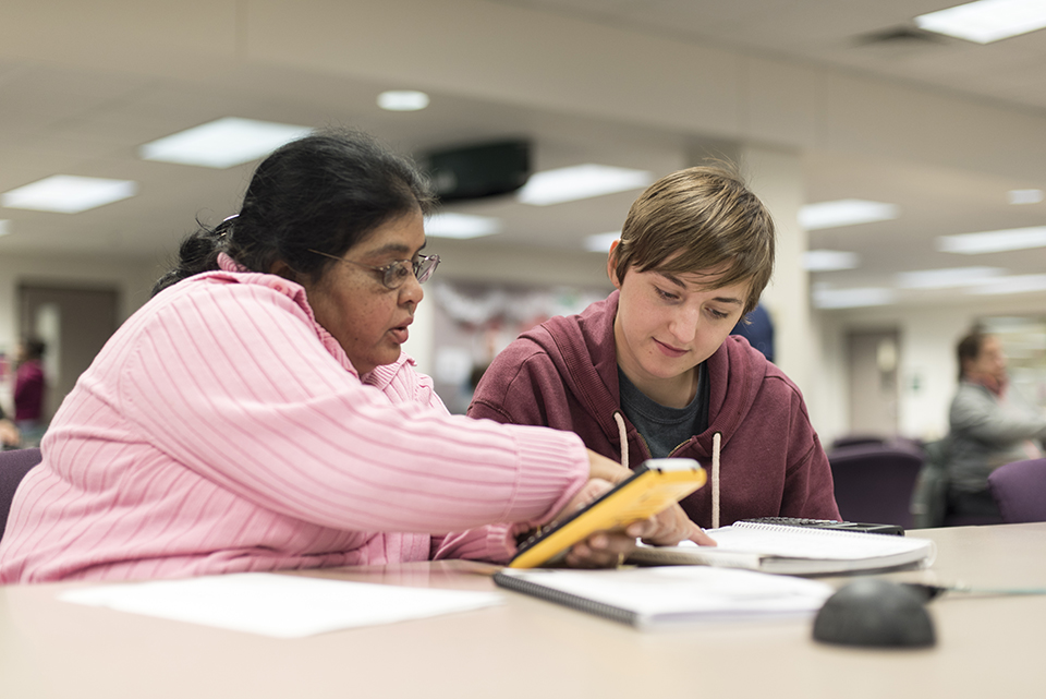 Student working with Tutor in the Library