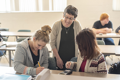 Beth Kelch working with students in class