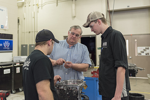 Big Thinker - Jim Miller Jim Miller working in Auto lab with two students
