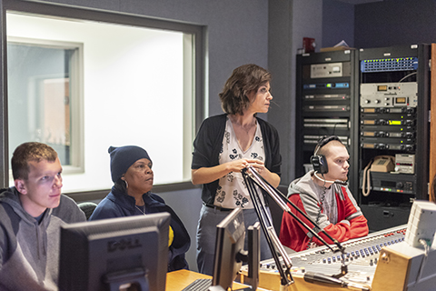 Kim working with students in Broadcasting studio