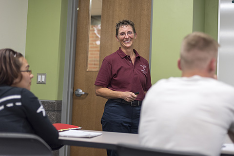 Michelle Whitaker in front of one of her classes