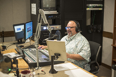 A Delta employee working in the radio studio