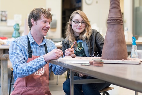 Ceramic student with instructor