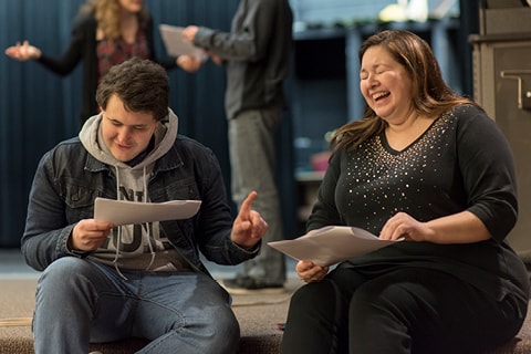 Students practicing lines in the theater