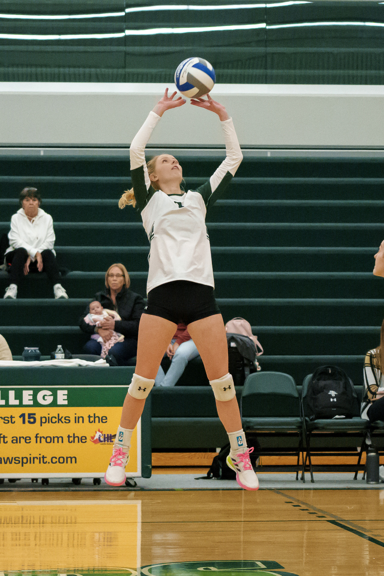 Delta College Volleyball player jumps high for ball