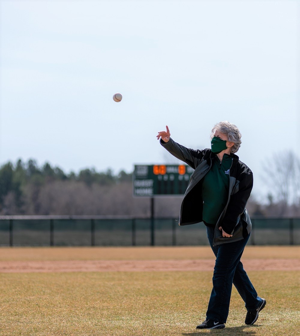 Dr. Jean Goodnow throws the first pitch.