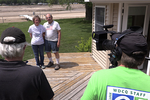 Couple being interviewed by news team