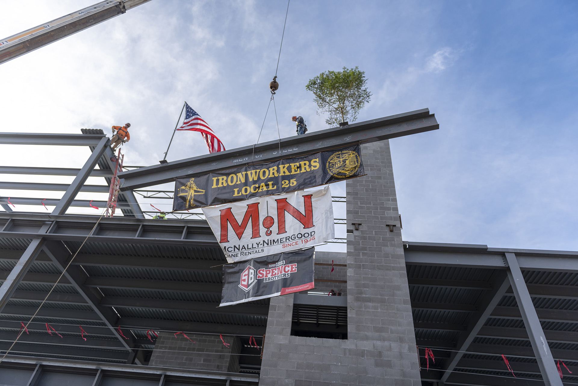 Looking up at the beam being placed on the structure