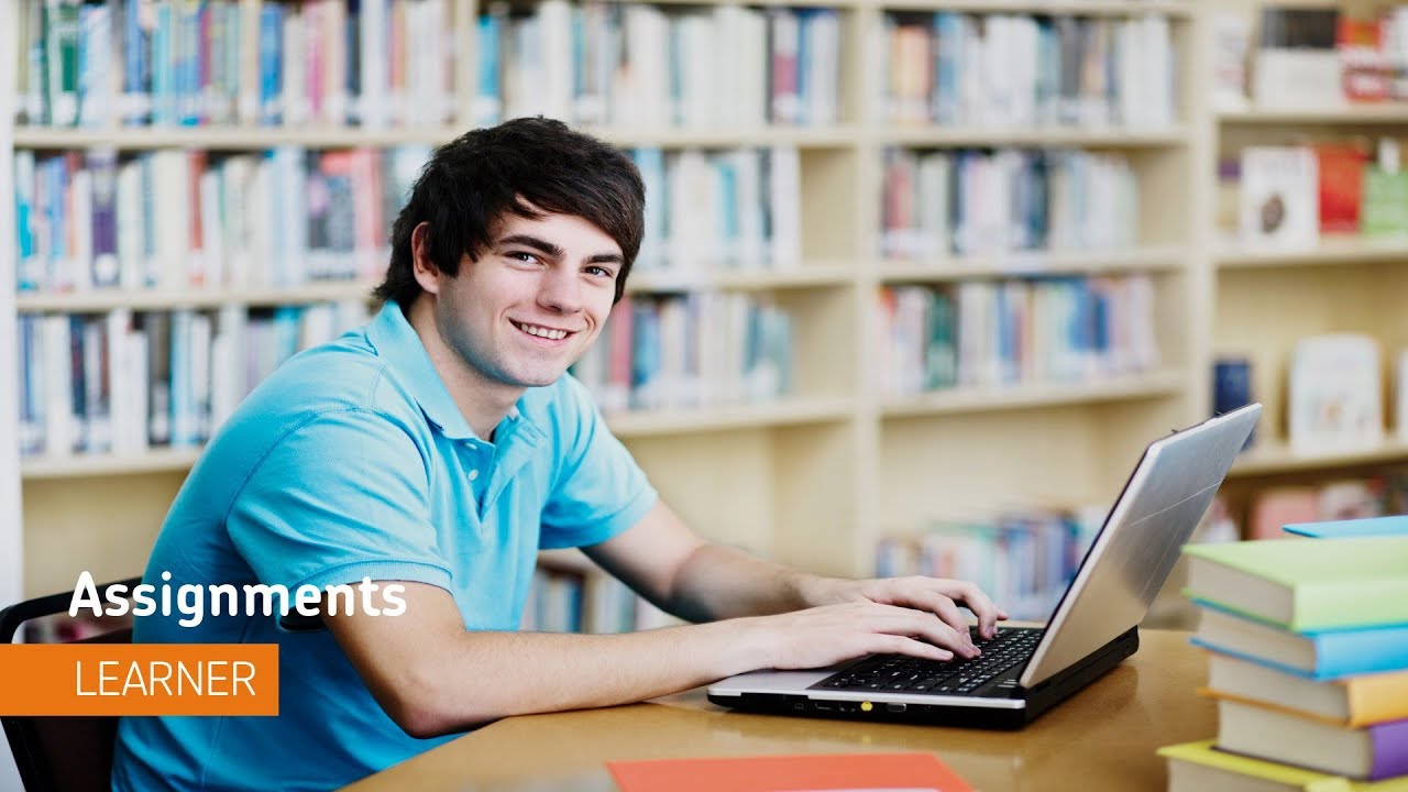 Student at their laptop in a library.