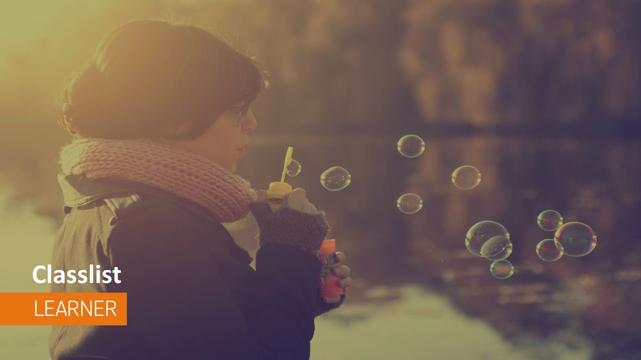 Person blowing bubbles.