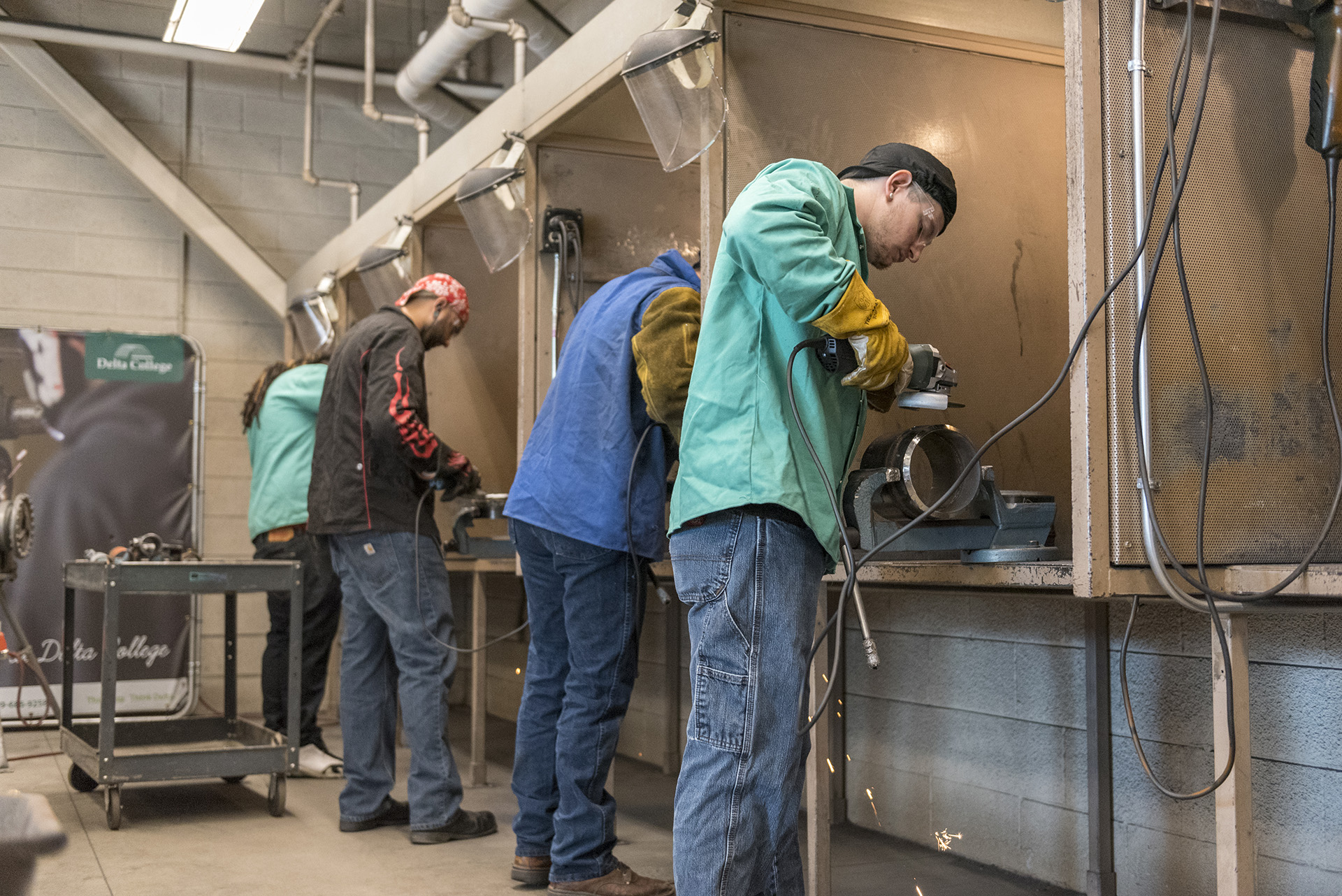 Students practice their hand welding skills in the welding lab.