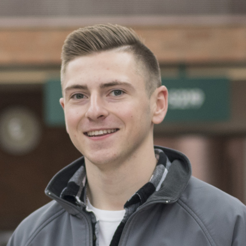 A smiling Delta student