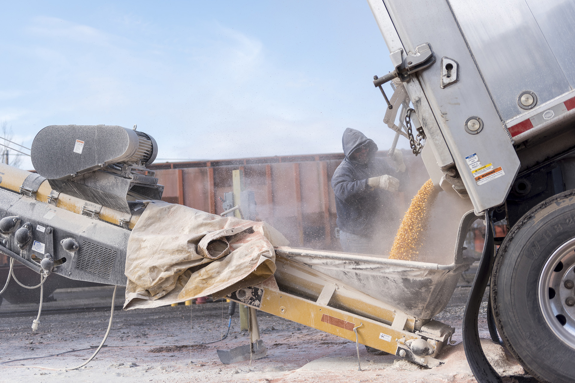 Agriculture student working outside with a large crop truck