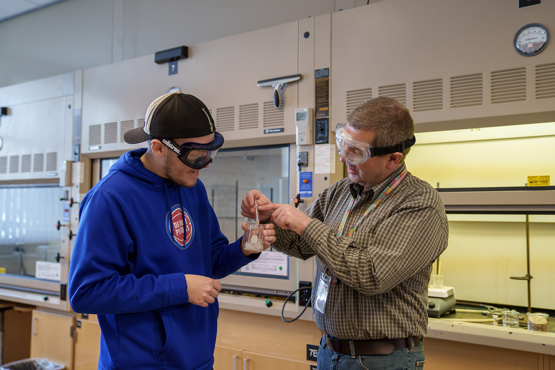 Chemistry student with instructor