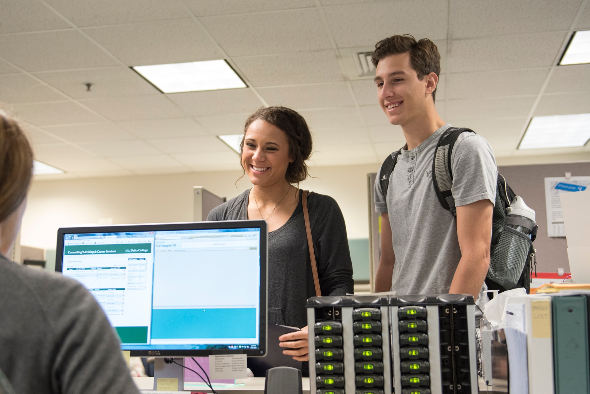 Students at the counter in the Academic Advising office