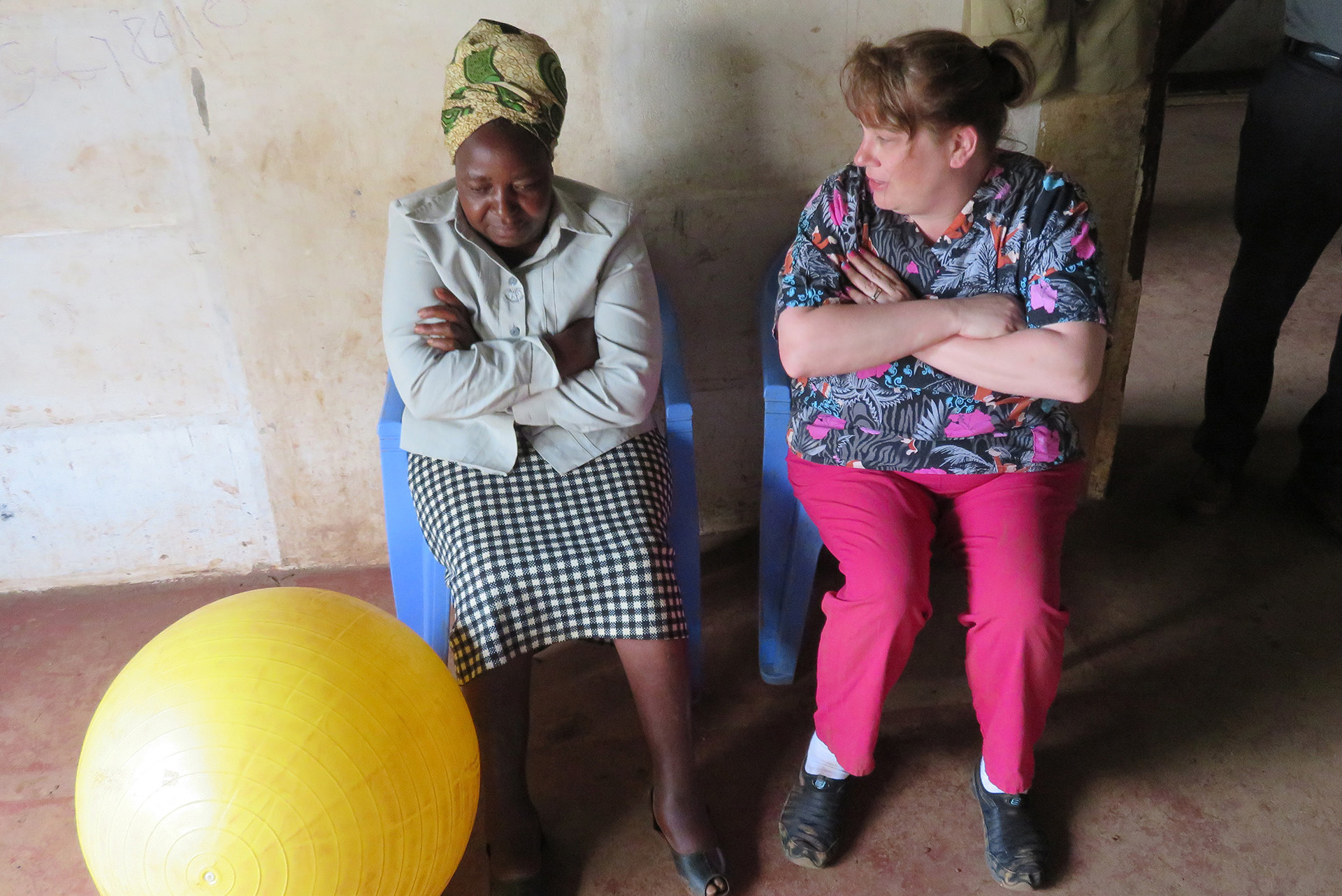 Student working with Kenyan woman