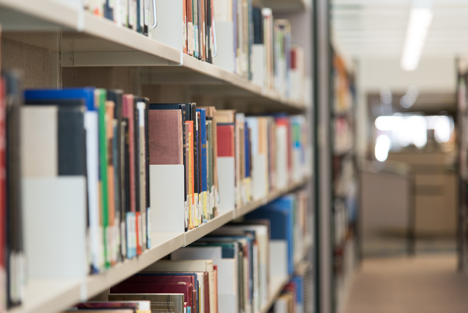 Library shelves with books