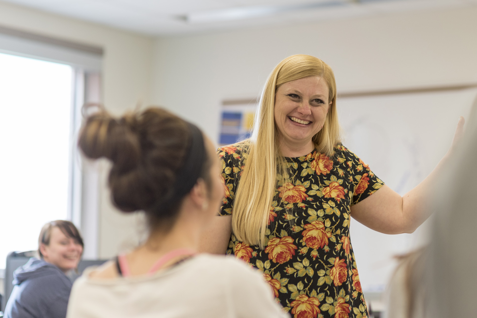 Accounting professor working with students in class.