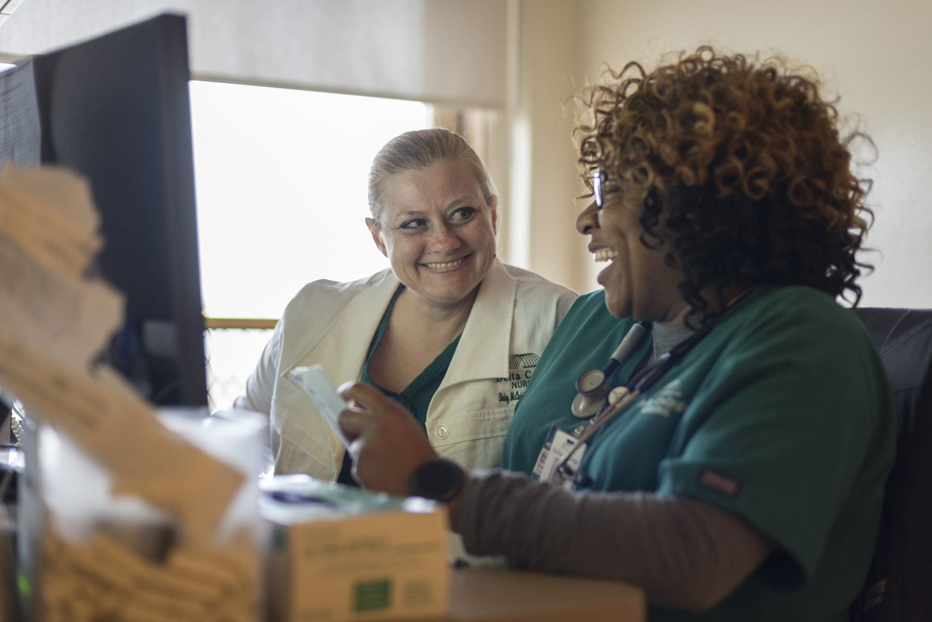 Nursing student working with faculty in hospital