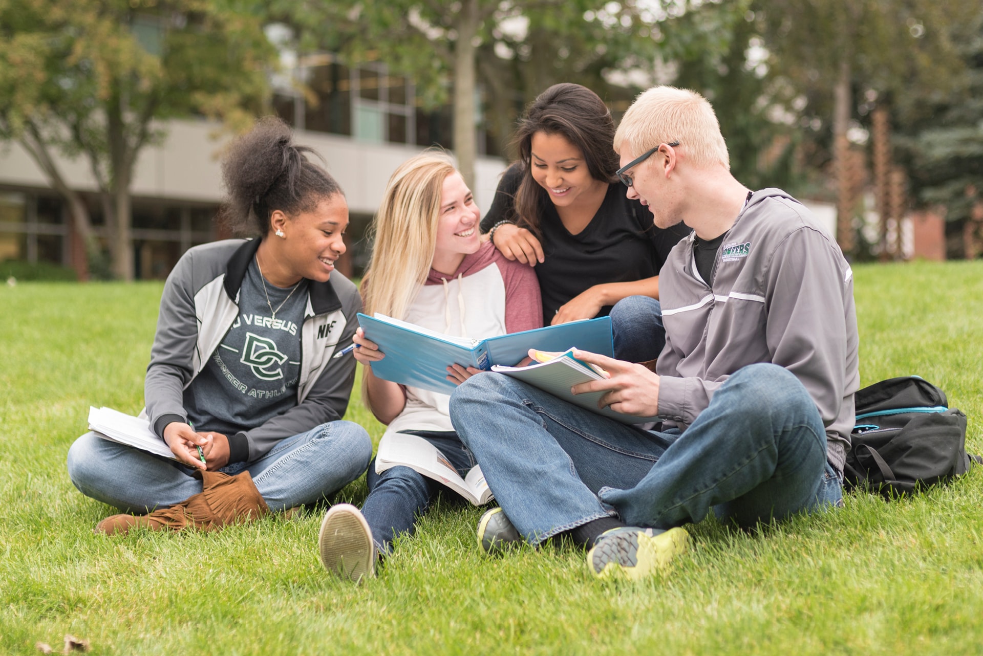 Group of students studying in courtyard