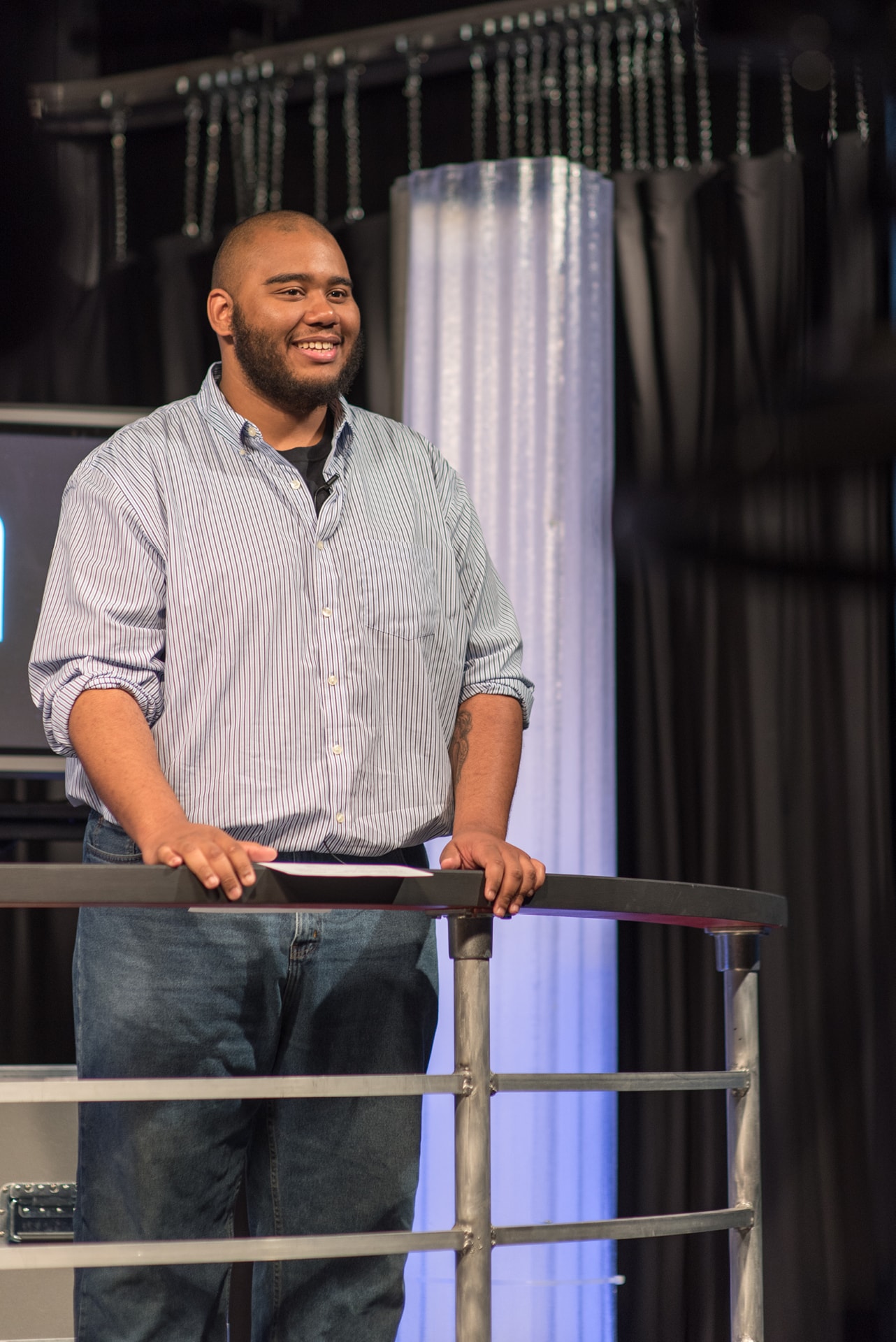 Student on stage in the broadcasting studio