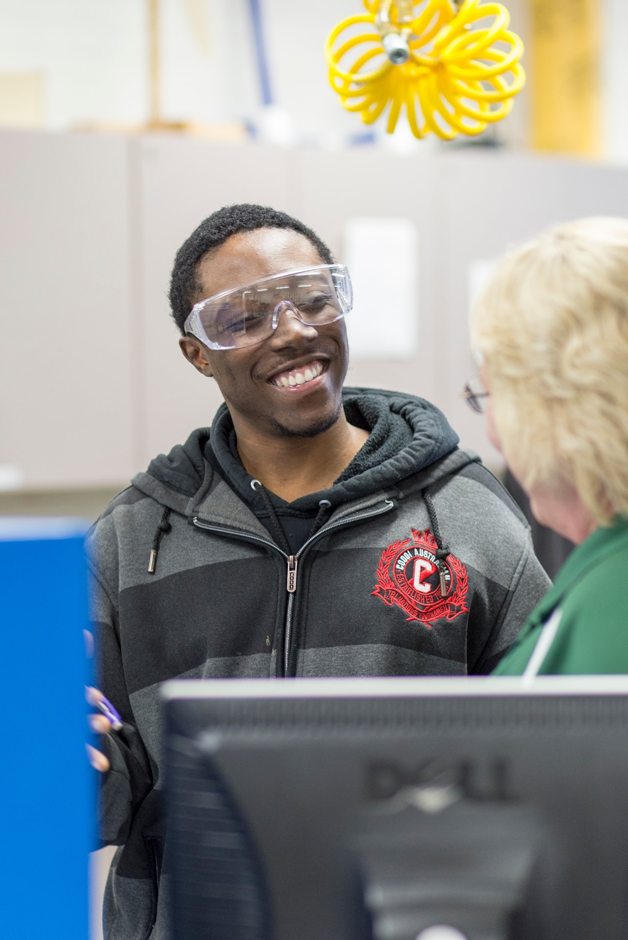 Instructor with student in the electrical lab